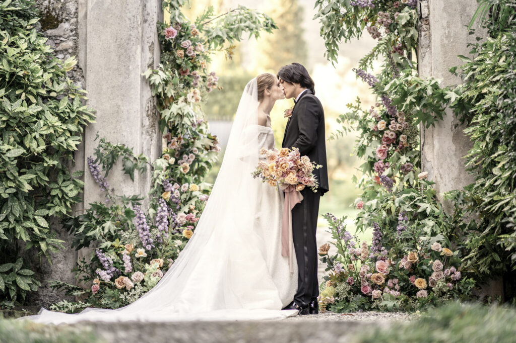 Bride and groom models kissing during a styled wedding shoot at Villa Sola Cabiati in Italy.