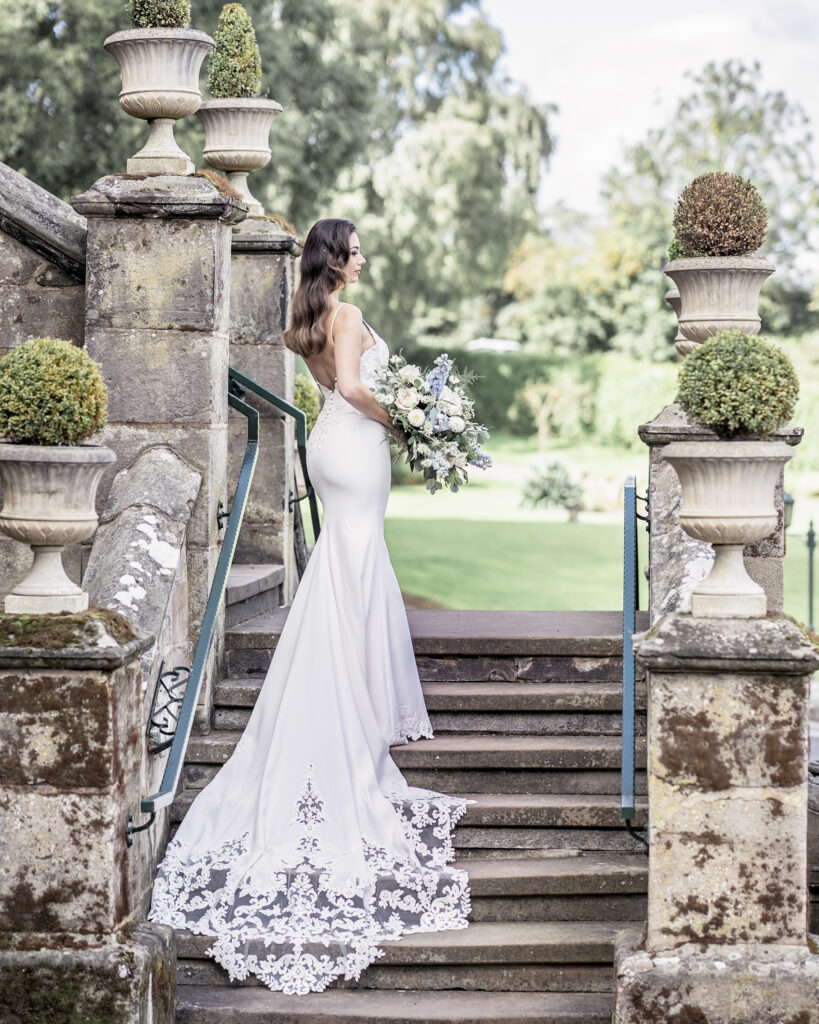 Bridal model posing and standing on steps for a bridal photo shoot